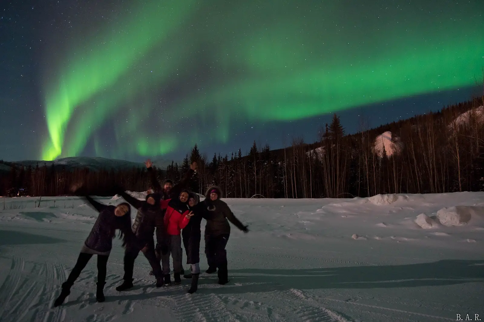 Aurora over snowy forest near Fairbanks