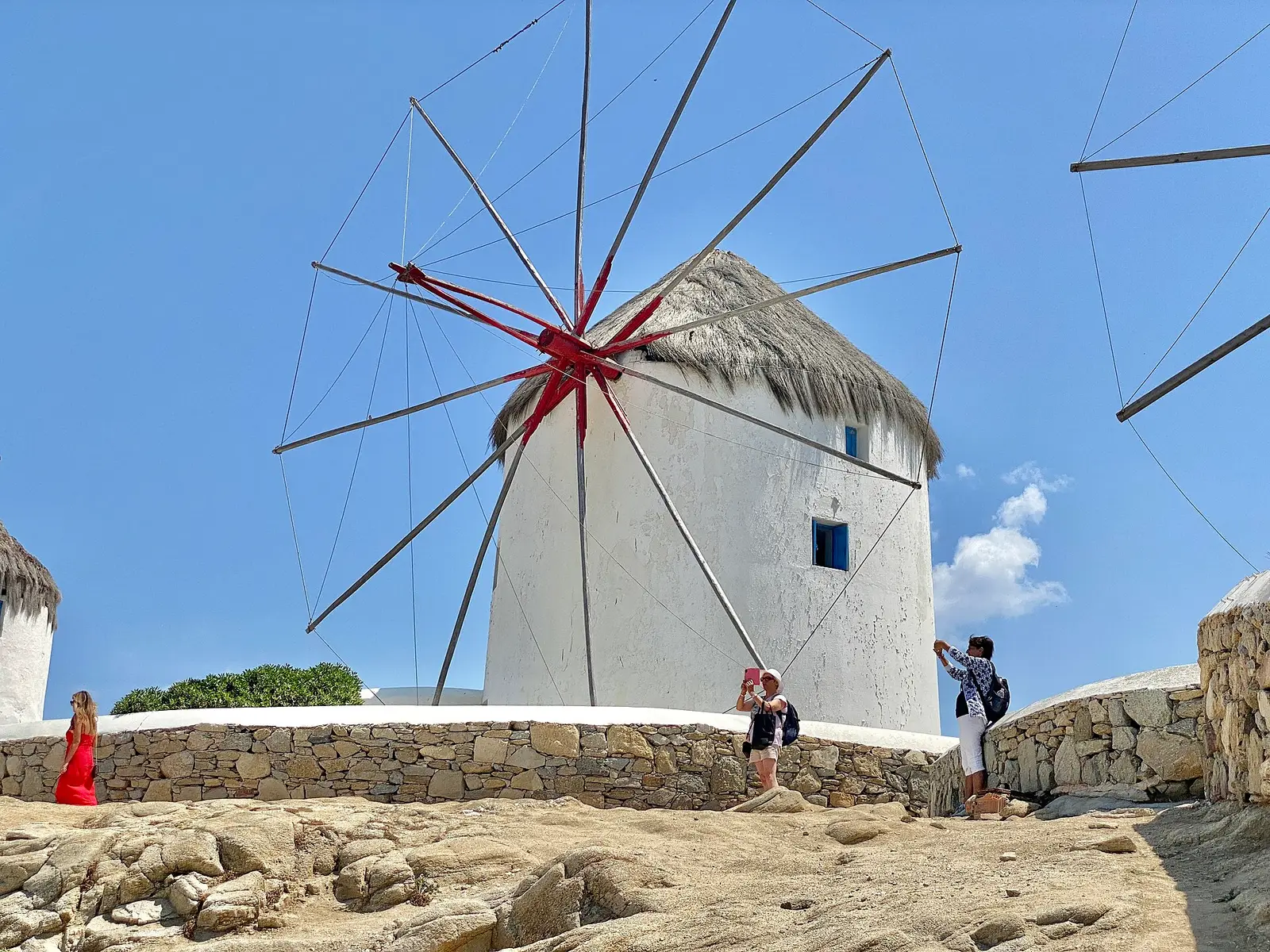 White windmills by the sea on Mykonos